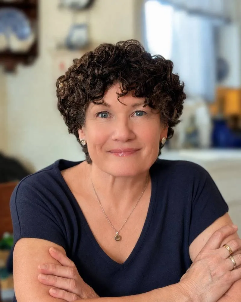 Teri Rosendale smiling in a kitchen.